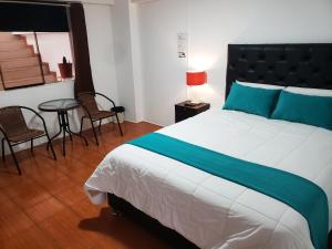 Postel nebo postele na pokoji v ubytování Cusco de mis Sueños Hostal - II