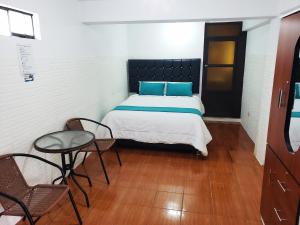 Postel nebo postele na pokoji v ubytování Cusco de mis Sueños Hostal - II