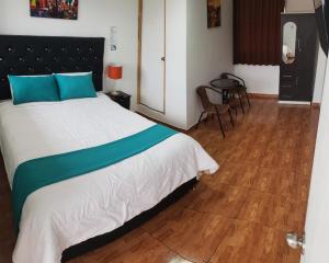 Postel nebo postele na pokoji v ubytování Cusco de mis Sueños Hostal - II