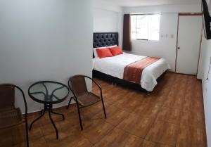 Postel nebo postele na pokoji v ubytování Cusco de mis Sueños Hostal - II