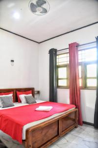 Postel nebo postele na pokoji v ubytování Bliss Inn