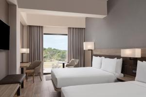Voodi või voodid majutusasutuse AC Hotel by Marriott Punta Cana toas