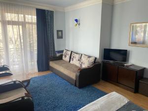 TV a/nebo společenská místnost v ubytování Casanova Inn - Boutique Hotel