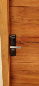 a close up of a wooden door with a lock at One4ALL in Chennai