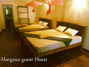 Postel nebo postele na pokoji v ubytování Margosa Guesthouse