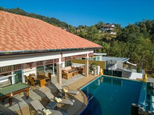 an aerial view of a house with a swimming pool at Karon Bliss: 4 Bedroom Haven in Karon Beach