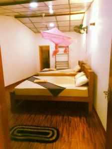 Postel nebo postele na pokoji v ubytování Margosa Guesthouse
