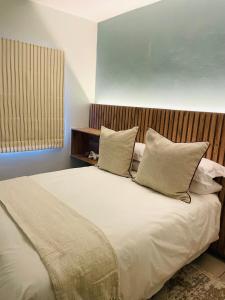 Ένα ή περισσότερα κρεβάτια σε δωμάτιο στο Atlantis Luxe escape Unit 25