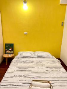 Postel nebo postele na pokoji v ubytování Wangs Hostel