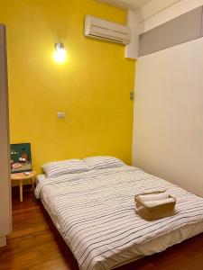 Postel nebo postele na pokoji v ubytování Wangs Hostel