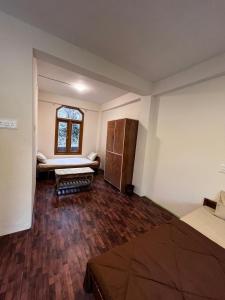 Postelja oz. postelje v sobi nastanitve Nomadic Den Manali