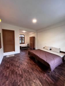 Postelja oz. postelje v sobi nastanitve Nomadic Den Manali