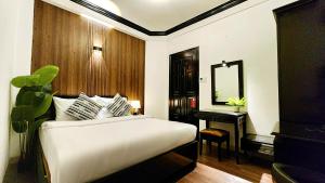 Giường trong phòng chung tại Rosa May Hotel