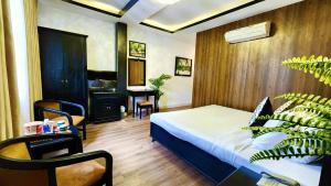 Giường trong phòng chung tại Rosa May Hotel