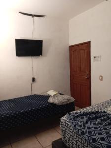 Postel nebo postele na pokoji v ubytování Hotel Colonos Los Cabos
