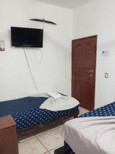 Postel nebo postele na pokoji v ubytování Hotel Colonos Los Cabos