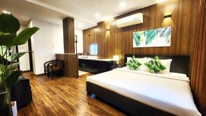 Giường trong phòng chung tại Rosa May Hotel
