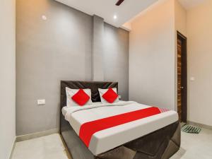 Postel nebo postele na pokoji v ubytování Hotel O Iris Lite