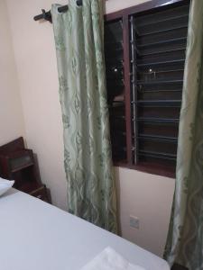 Katil atau katil-katil dalam bilik di The Truenorth apartments Diani +5 gambar