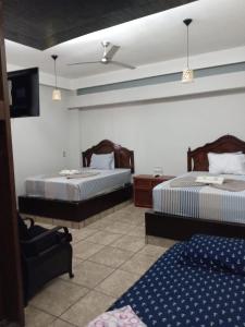 Postel nebo postele na pokoji v ubytování Hotel Colonos Los Cabos