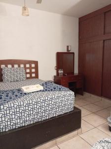 Postel nebo postele na pokoji v ubytování Hotel Colonos Los Cabos