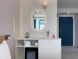 Postel nebo postele na pokoji v ubytování Hotel Haeundae Elysia