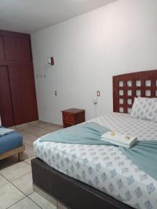 Postel nebo postele na pokoji v ubytování Hotel Colonos Los Cabos
