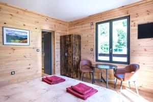 TV a/nebo společenská místnost v ubytování Apart Hôtel des Cols