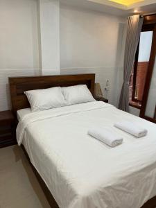 Postel nebo postele na pokoji v ubytování Gusti Room II