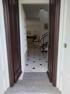 an open door to a hallway with a tile floor at Casa Rosella in Albenga