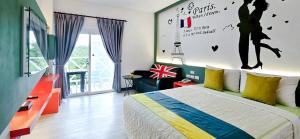 Rúm í herbergi á Ocean Star B&B