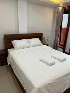 Postel nebo postele na pokoji v ubytování Gusti Room II