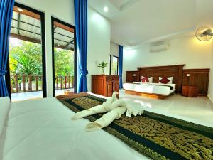 Postel nebo postele na pokoji v ubytování Phnom Tbeng Resort