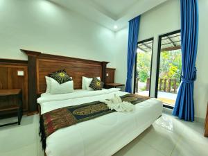 Postel nebo postele na pokoji v ubytování Phnom Tbeng Resort