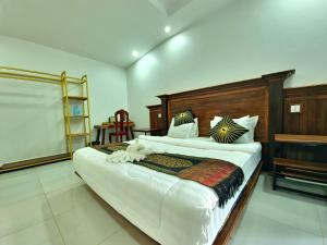 Postel nebo postele na pokoji v ubytování Phnom Tbeng Resort