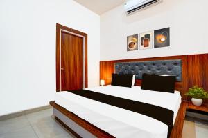 Postel nebo postele na pokoji v ubytování Hotel O ADVENT HOTEL