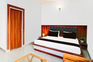 Postel nebo postele na pokoji v ubytování Hotel O ADVENT HOTEL