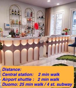 a bar in a room with a counter at CSI Group - Hotel Central Station in Milan