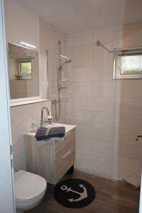Koupelna v ubytování Schönes Appartement in ruhiger Lage + 9 fotografií