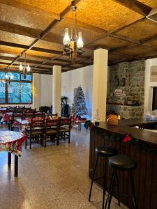 a restaurant with a christmas tree and tables and chairs at Galata's Bridge Hotel in Galata