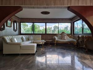 Posezení v ubytování ไททำดี โฮมสเตย์ Taitam-D Homestay