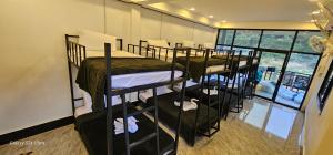 a group of bunk beds in a room at INN RIVERSIDE HOSTEL Pb in Pakbeng