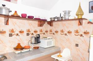 a kitchen with a counter with pots and pans at Vivienda DarnA in Inezgane