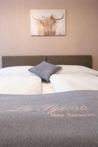 Postel nebo postele na pokoji v ubytování La Tgoma - Hotel & Restaurant