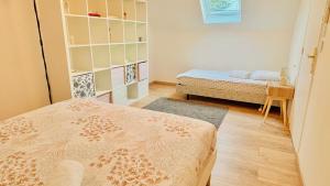 a room with two beds in a room at VILLA GIULIA 4-star 5min CDG Airport - 20min Disney in Gressy