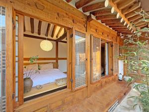 Postel nebo postele na pokoji v ubytování Hanok J'Nor