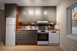 Η κουζίνα ή μικρή κουζίνα στο ARCTIC HOMES - Scandinavian 1&2 BR Apartments
