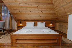 Postel nebo postele na pokoji v ubytování Hotel Porto Tara