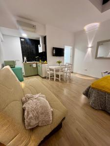 a living room with a couch and a table at Apartamentos Rey 2 in Prado del Rey