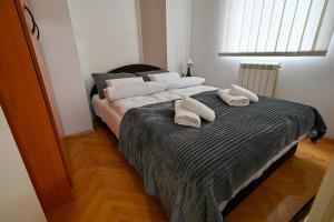 Postelja oz. postelje v sobi nastanitve Apartman Dunja